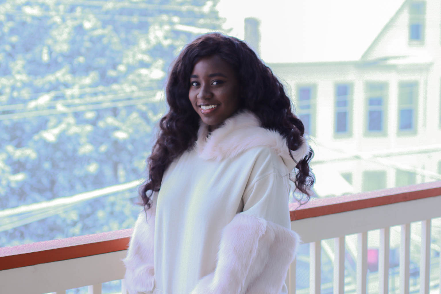 Big curly hair and faux fur hoodie